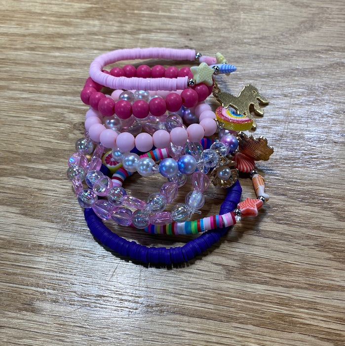 Kids Stack Bracelets - Grab Bag Style! What you see in the picture is a stack of bracelets. You will get one bracelet in a color tone of your choice.