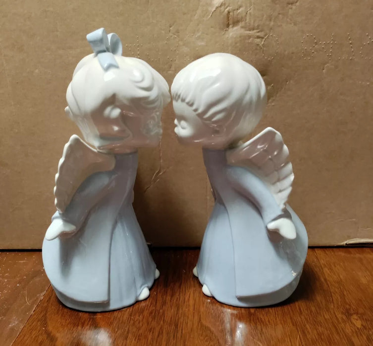 Set of 2 Vintage Kissing Angels.  Blue & White Ceramic.  The Girl Angel is cracked and repaired at the bottom.  See pics.  Sold as a set.