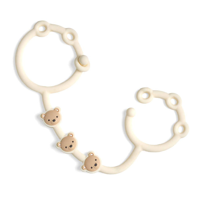 Itzy Strap™.  Use these to connect anything to your stroller, car seat, etc.