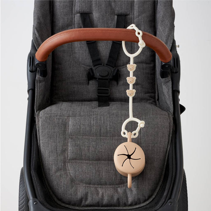 Itzy Strap™.  Use these to connect anything to your stroller, car seat, etc.