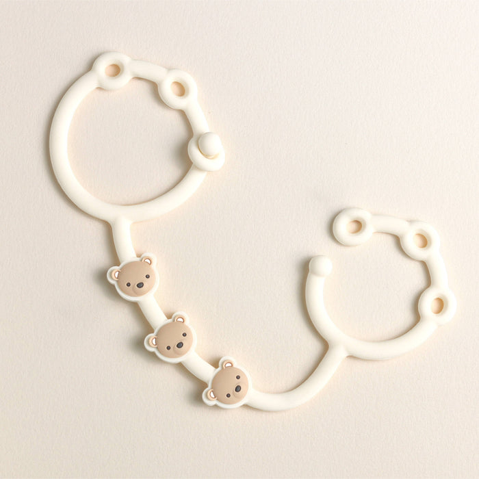 Itzy Strap™.  Use these to connect anything to your stroller, car seat, etc.