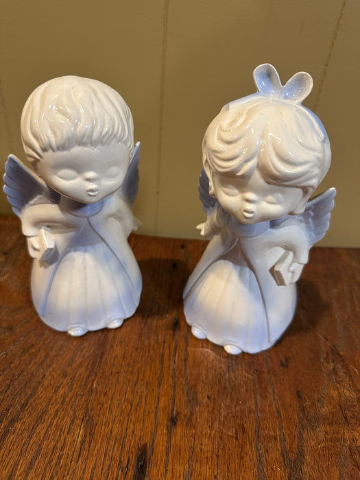 Set of 2 Vintage Kissing Angels.  Blue & White Ceramic.  The Girl Angel is cracked and repaired at the bottom.  See pics.  Sold as a set.