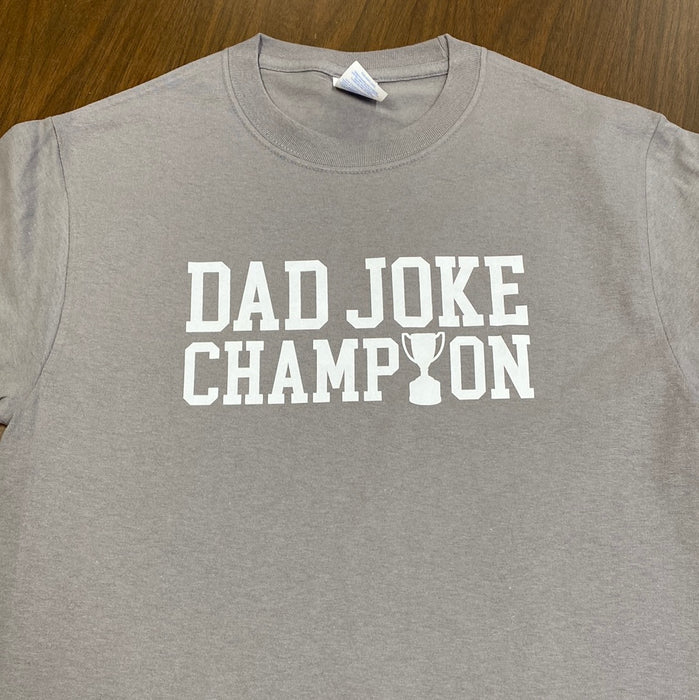 Dad Joke Champion. $6 CLEARANCE TEES!  $8 For Long Sleeves!  Random Shirt Color Chosen.