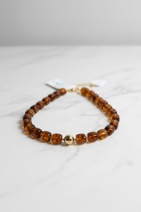 Dark Brown Beaded Necklace with Gold Ball in the Center