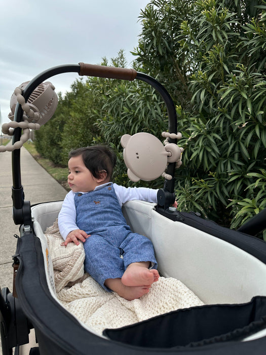 Itzy Peek Stroller Mirror™.  Bendable legs to attach wherever you need it.