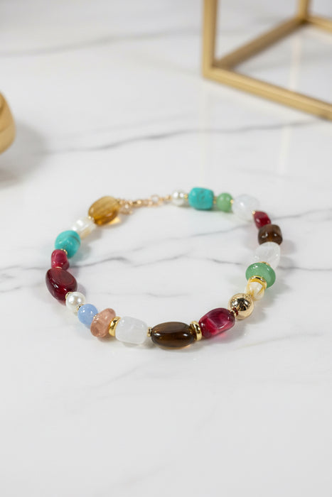 Colorful Beaded Necklace with Gold Ball in the Center and Gold Accents