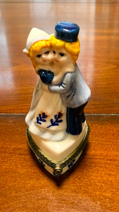 Vintage Delft Blue Holland Girl & Boy Figurine Hand Painted Trinket Box.  3.25” tall.