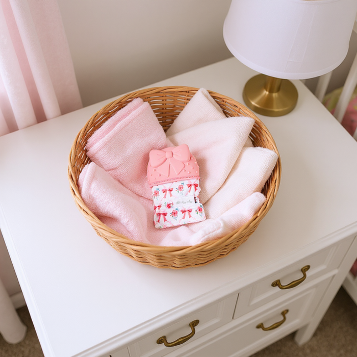 Itzy Mitt™ Silicone Teething Mitts: Bow