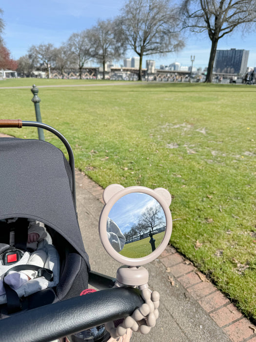 Itzy Peek Stroller Mirror™.  Bendable legs to attach wherever you need it.